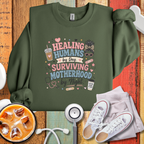 Surviving Motherhood By Night Sweatshirt